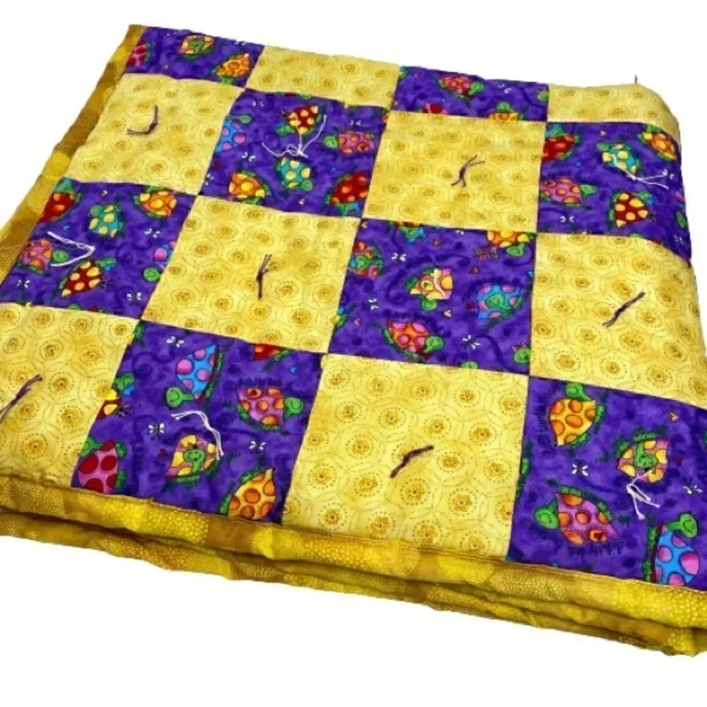 Handmade NWT turtle themed purple and gold baby or lap quilt size 43” X 38”